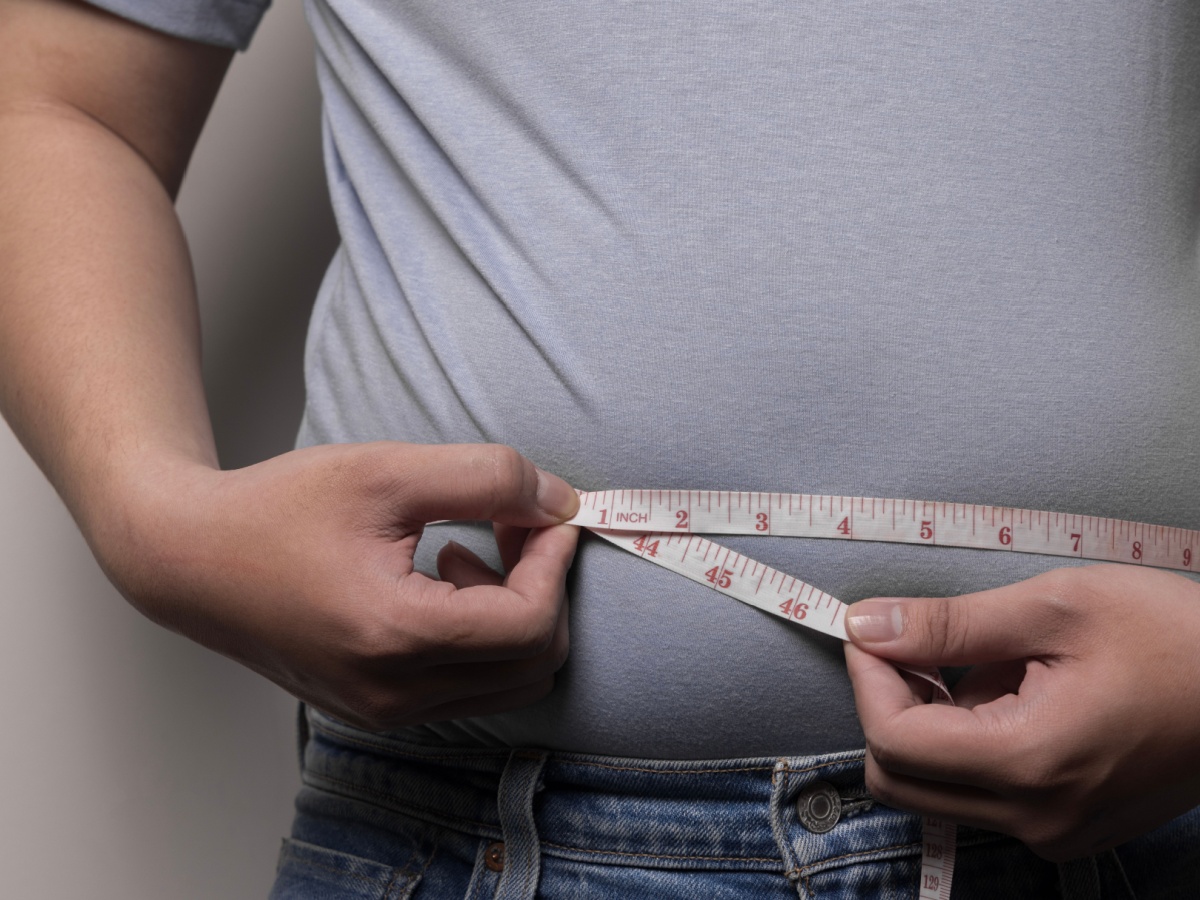 Obese Man Measuring Waist